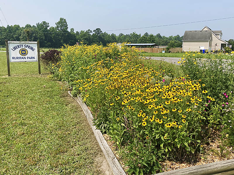 Garden and sign at Liberty Springs Ruritan Park